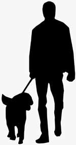 guy hiking with a dog on a leash